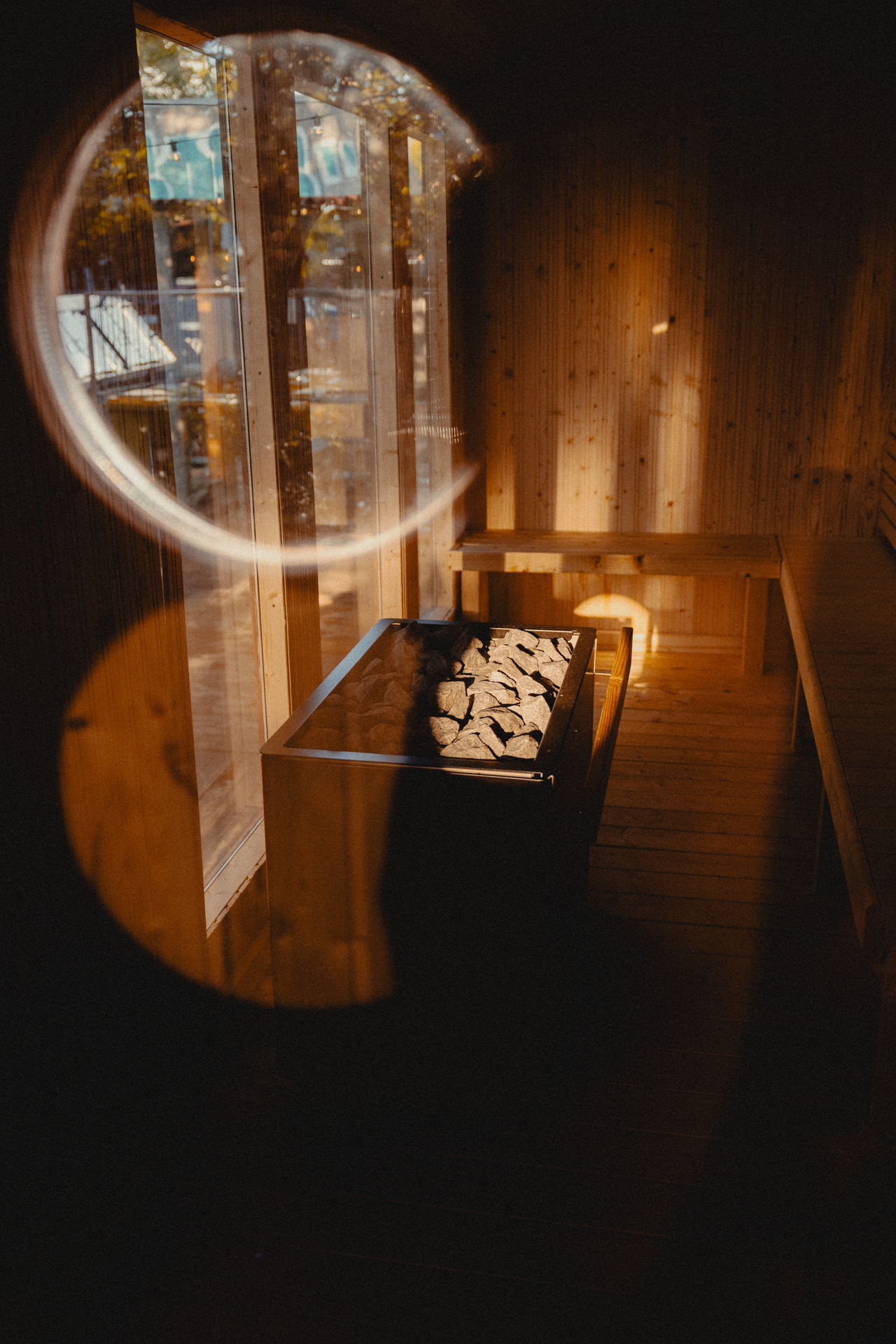 Sauna heater with stones in warm evening light at SOKI